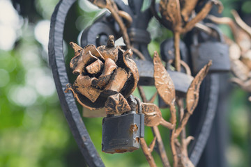 Forged roses from metal and the castle left in love with a closeup