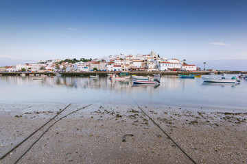 Fototapeta na wymiar Ferragudo village reflection in bay, Portugal