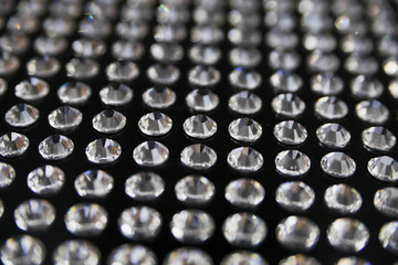 Diamonds glued on a black surface