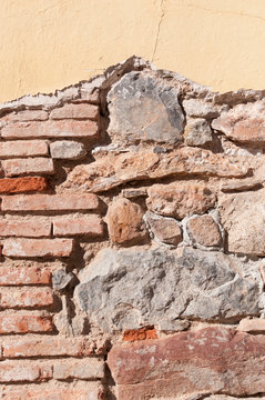 Old wall with different types of bricks