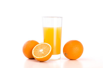 Glass of orange juice and oranges on white bacground
