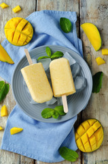 Creamy mango ice cream with fruits and ices