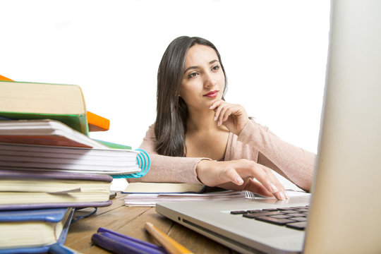 Female student in exams with books