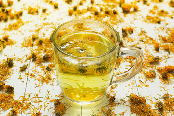 Herbal tea and dried flowers of medicinal calendula, homeopathy and aromatherapy.