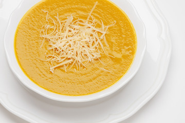 Plate of pea cream soup with cheese