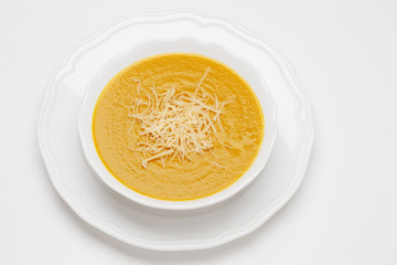 Plate of pea cream soup with cheese