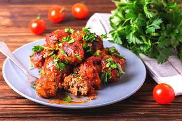 Traditional Italian beef meatballs, tomato sauce and parsley