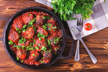 Traditional Italian beef meatballs, tomato sauce and parsley