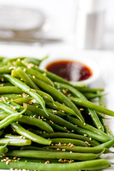 Asian green bean salad on a white plate 
