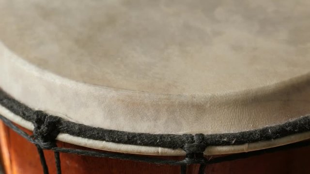 Traditional goblet drum details and playing surface 4K 2160p 30fps UltraHD tilting footage - Chalice tarabuka leather membrane slow tilt 3840X2160 UHD video