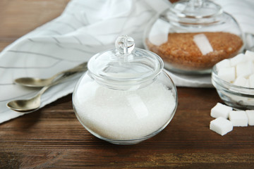Beautiful composition with sugar on wooden background