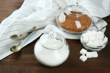 Beautiful composition with sugar on wooden background