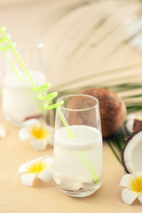 Glass of coconut water on table