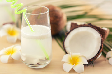 Glass of coconut water on table