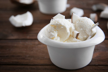 Fresh coconut ice cream on wooden table