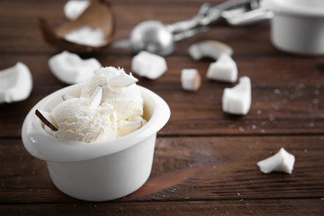 Fresh coconut ice cream on wooden table