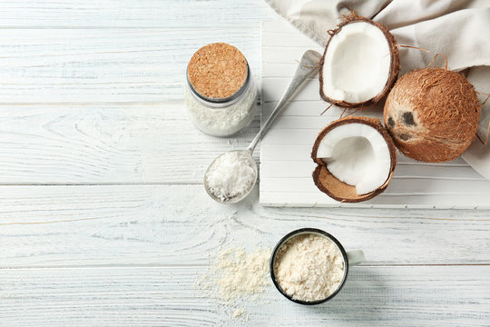 Composition with coconut flour on wooden background