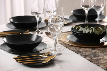 Table with beautiful setting in restaurant, closeup