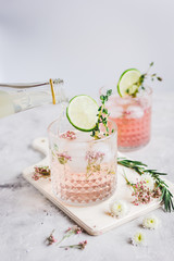 summer homemade juice with lime and blossom on stone table background