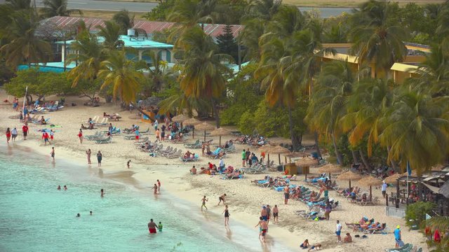 St. Thomas US Virgin Islands Tropical Beach Resort on Lindbergh Bay with Tourists Enjoying Summer Vacation in an Exotic Palm Tree Setting