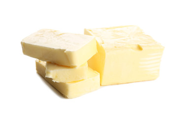 Delicious butter pieces on white background, closeup