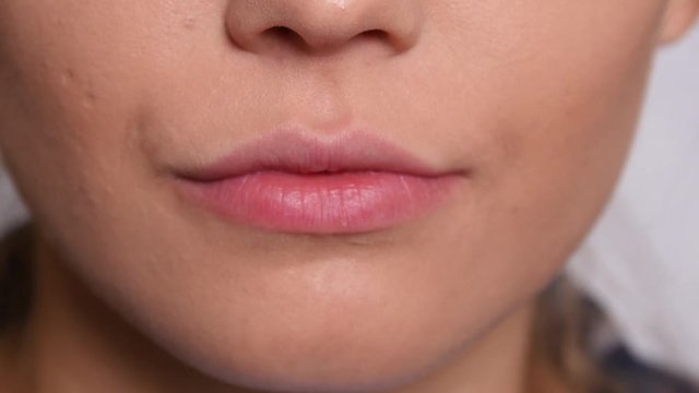 Extreme closeup of woung woman's mouth