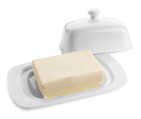 Dish with butter on white background