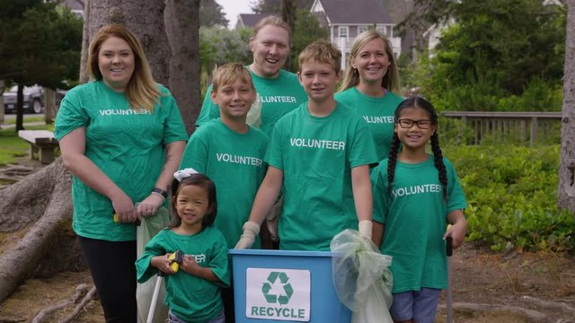 Portraif of a group of volunteers at park cleanup