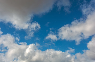 Obraz premium Voluminous clouds on a blue summer .