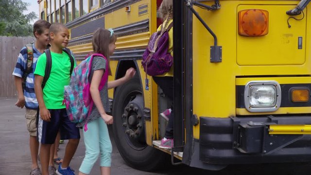 Students get onto school bus