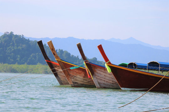 Boats on sea clam and clear beautiful sky and lsland