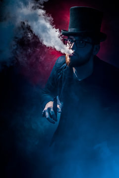 Man with beard smoking electronic sigarette