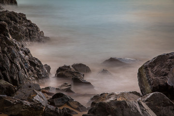 Long Exposure of Rocks and Waves at the Beach