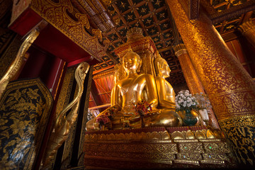  The main buddha golden statues in main church of Wat Phu Mintr, is very beautiful and respect in Nan, Thailand