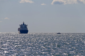 Ship and Tug Boat Out On the Water