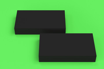 Black blank business cards mock-up on green background