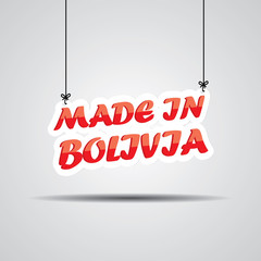 Obraz na płótnie Canvas Made in Bolivia Sign Hanging On Gray Background.
