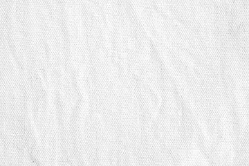 Fototapeta na wymiar Wrinkled white cotton canvas fabric textured background, wallpaper