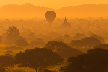 Beautiful silhouette landscape view of sunrise morning in Bagan, an ancient city located in the Mandalay Region of Myanmar.