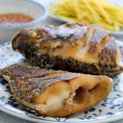 Vietnamese food, fried fish with mango