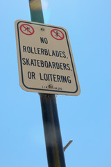 No rollerblades, skateboarding, loitering sign