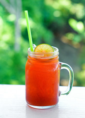 glass of ice tea with lime.