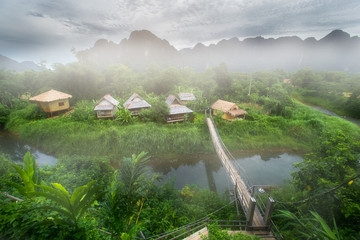 Village and mountain in Vang Vieng, Laos - obrazy, fototapety, plakaty