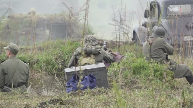  Historical reconstruction of Second World War. Soldiers on battle field during  assault on Fort 5 in Koenigsberg. hostilities of  Second World war. Slow Motion.