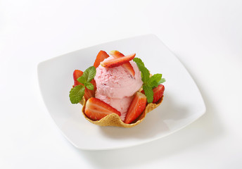 ice cream and strawberries in waffle basket