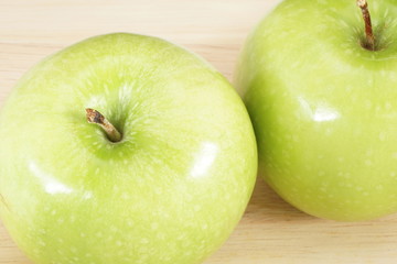 fresh green apple on wood