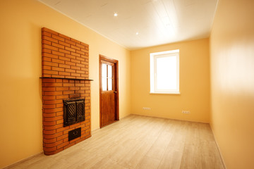 Empty room with window and turned on lights on the ceiling. New renovated apartment