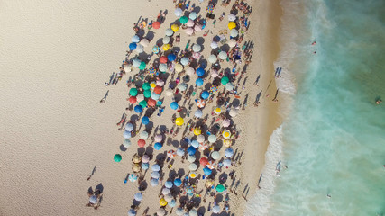 People on Ipanema Beach in Rio de Janeiro, Brazil. Aerial Top view with umbrellas