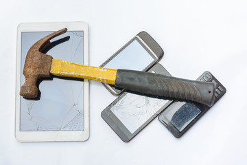 Hammer hit a tablet and smartphone to destroy