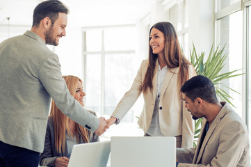 Business people shaking hands, finishing up a meeting